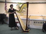 Susan demonstrates her Harp after the concert